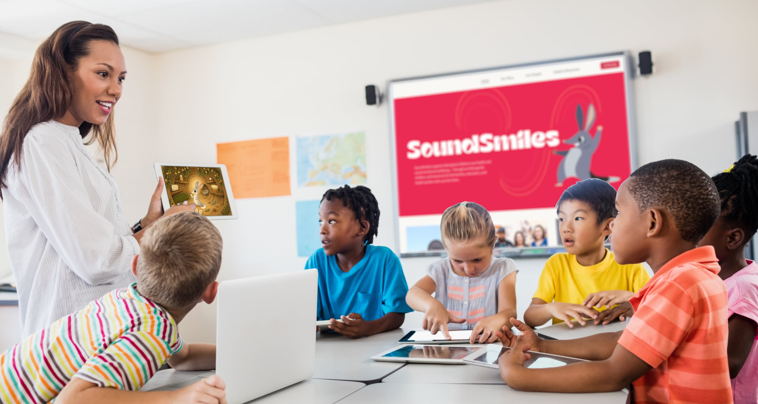 A teacher and children using SoundSmiles together in a classroom.