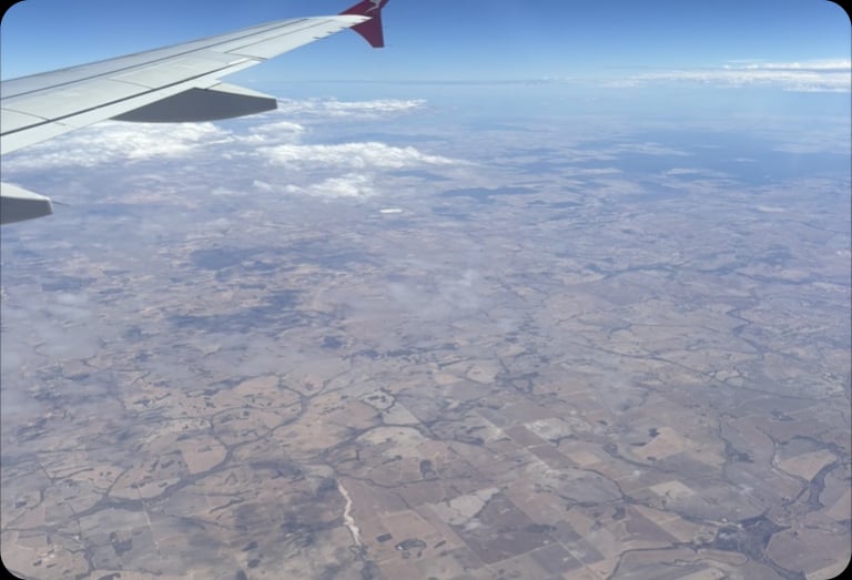 A view from an aircraft window — a symbol of the co-design journey with communities across Australia.